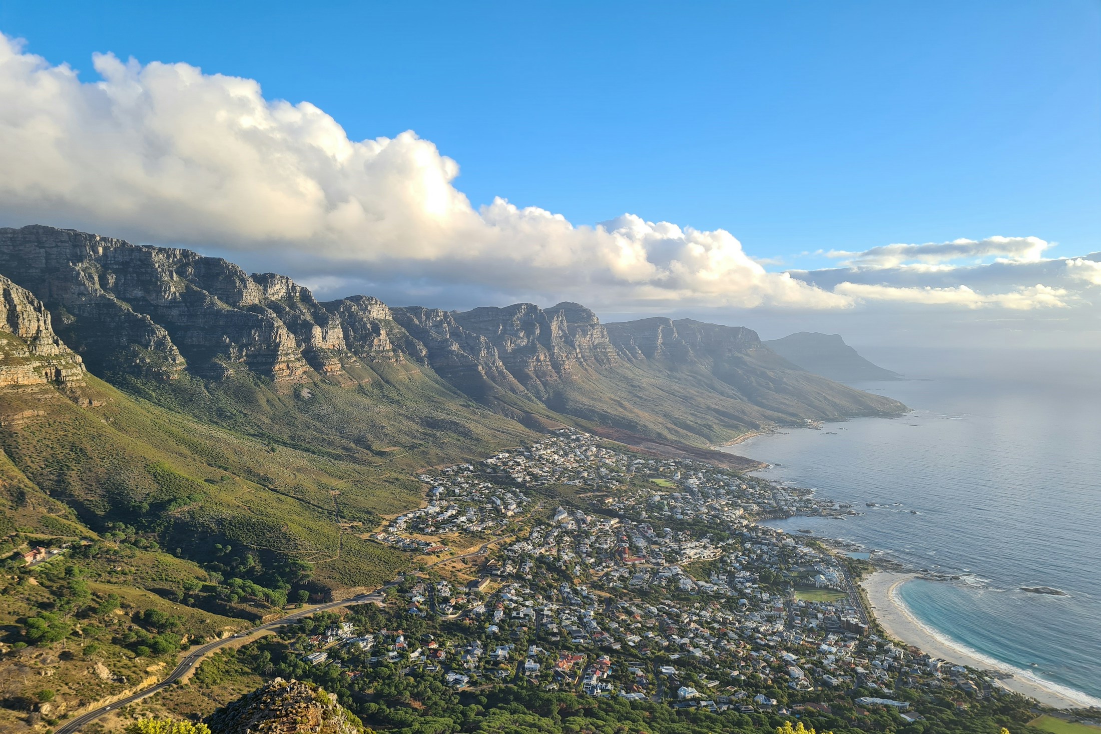 Aerial view of Cape Town's Atlantic seaboard, mountains, coastline, and city